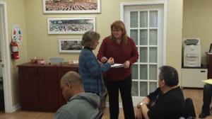 Business Representative Kim Valliere presents a small token of appreciation to Barbara Clark of the Durham Region Huntington Society after a powerful presentation on the services provided by the Huntington Society of Canada.